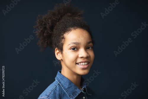 Closeup portrait of happy admiring smiling girl with afro hairstyle