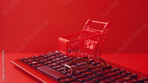 Online shopping concept, small shopping cart stands on keyboard, red clear background, digital e-commerce. Generative AI