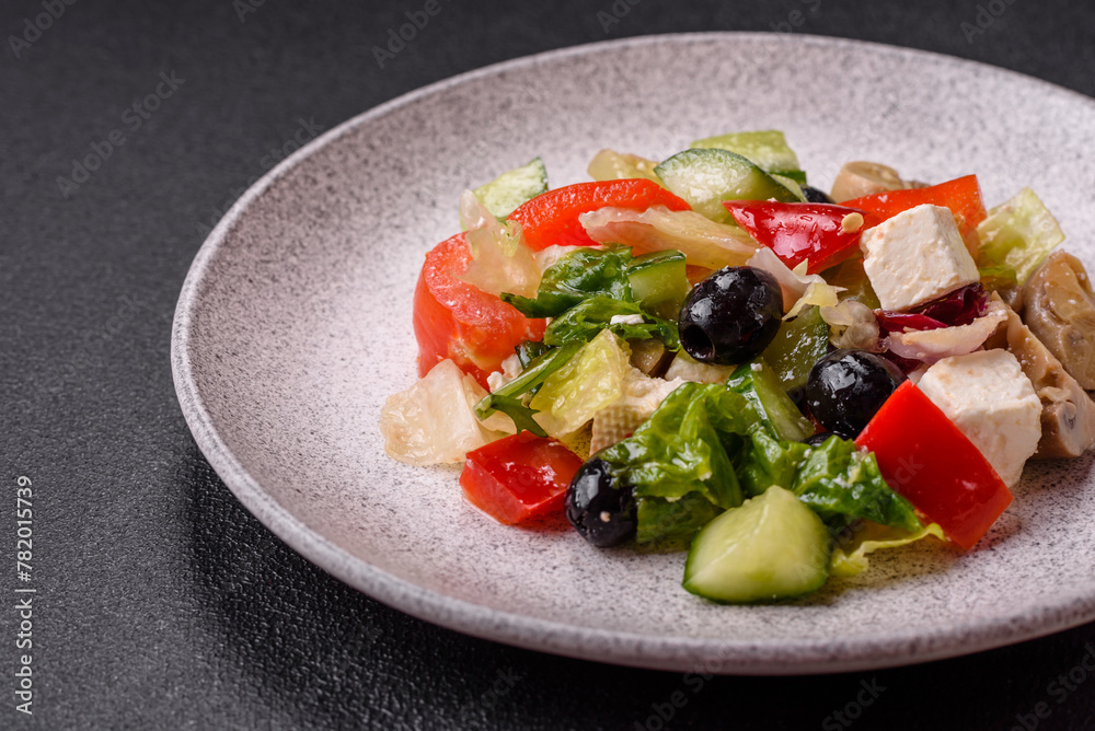 Delicious fresh juicy salad of sweet peppers, cheese, olives, tomatoes, cucumbers