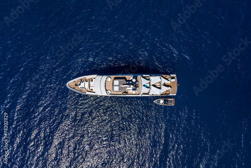 Aerial top view by drone of luxury yacht in the sea.
