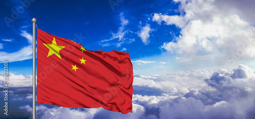 China national flag cloth fabric waving on beautiful Blue Sky Background.