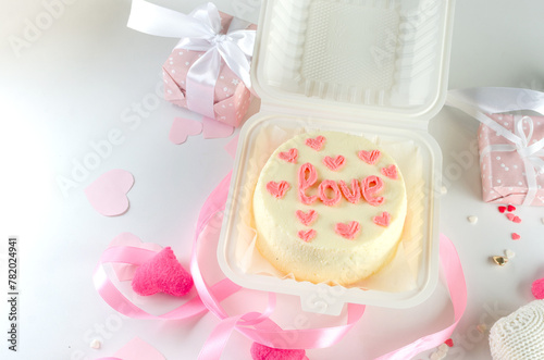 Little cake with "love" inscription. Cake for Valentine's Day, Mother's Day, or Birthday,