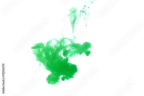 Green color dye melt on white background,Abstract smoke pattern,Colored liquid dye,Splash paint
