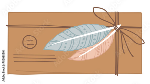 Vintage envelope tied with thread and feathers