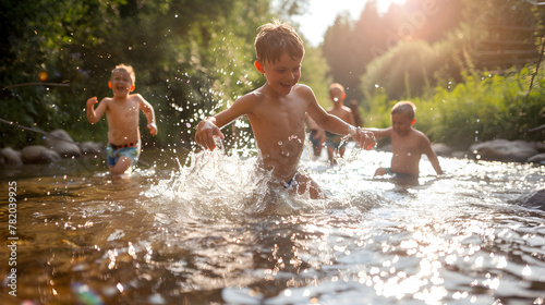 Joyful kids playing in a sparkling river on a hot summer day.