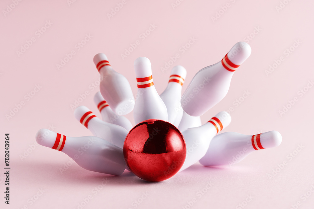 Bowling strike hit on pastel pink background. Minimal concept of success and win. Bowling strike hit on pastel pink background. Minimal concept of success and win.
