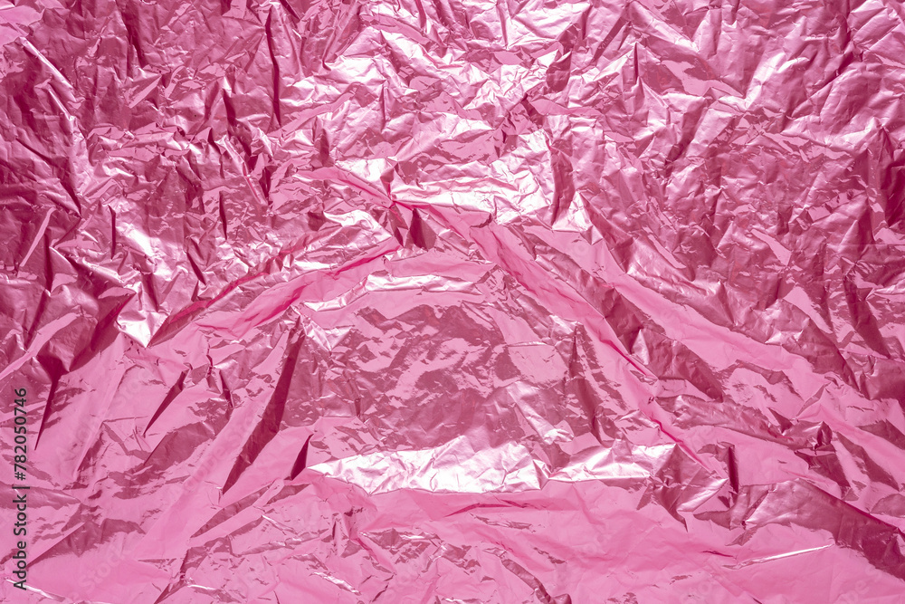 Abstract pink crumpled foil background. Minimal party concept. Abstract pink crumpled foil background. Minimal party concept.