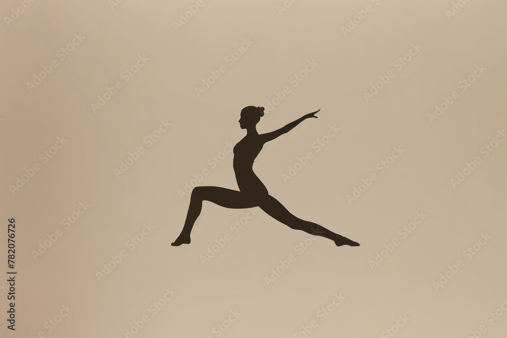 female silhouette performs a yoga tan female silhouette performs a yoga tan