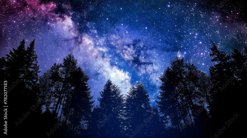 starry sky filled with numerous bright stars and the faint view of the Milky Way. Below, the silhouette of a dense forest starry sky filled with numerous bright stars and the faint view of the Milky Way. Below, the silhouette of a dense forest