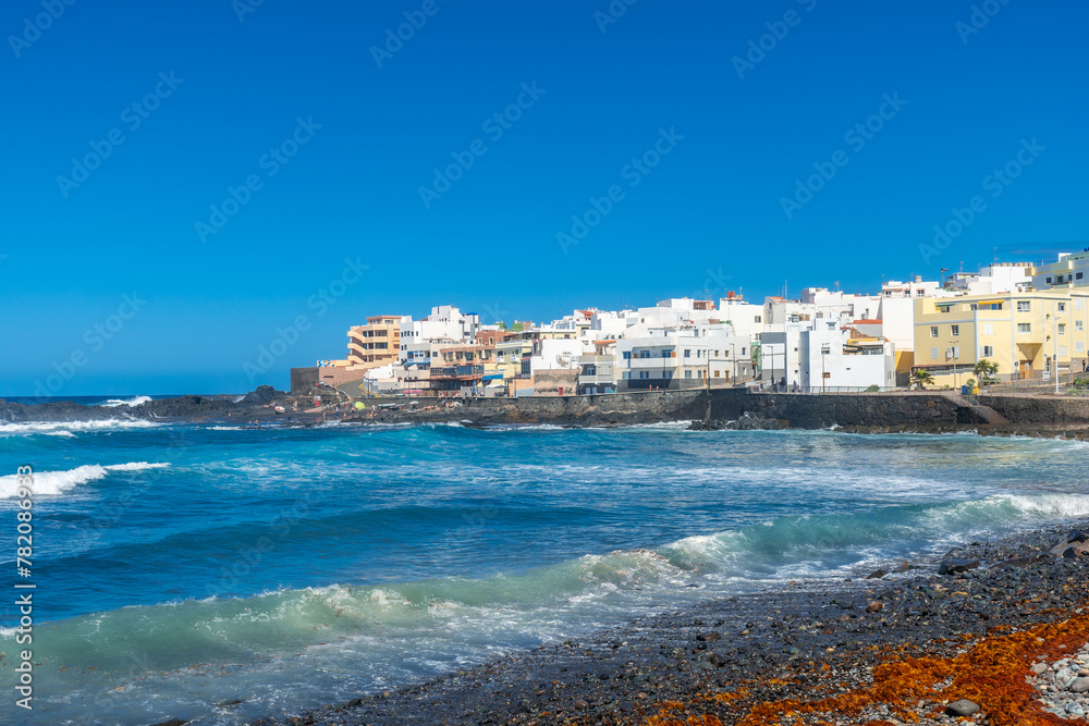 Beautiful beach in summer of Playa el Puertillo and its beautiful town in Gran Canaria. Spain