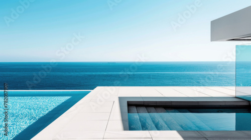 Modern swimming pool blending into the horizon of a vast ocean, offering a stunning vista of clear blue waters meeting the sky