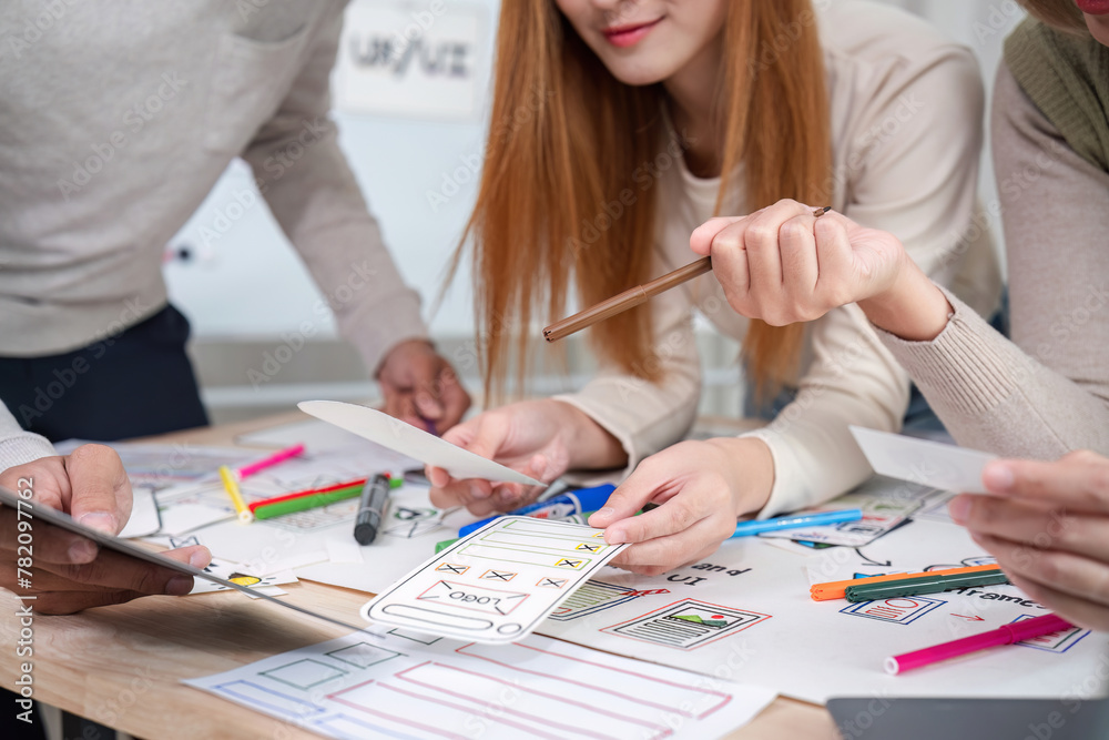 Creative designer team meeting on application design and ux ui usability planning. business team teamwork. Creative designer team meeting on application design and ux ui usability planning. business team teamwork.