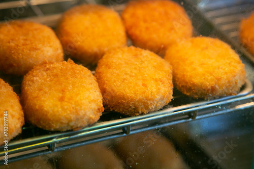 Japanese croquettes are called Korokke (コロッケ) and the classic style is made of mashed potatoes mixed with sauteed ground beef and onion. 