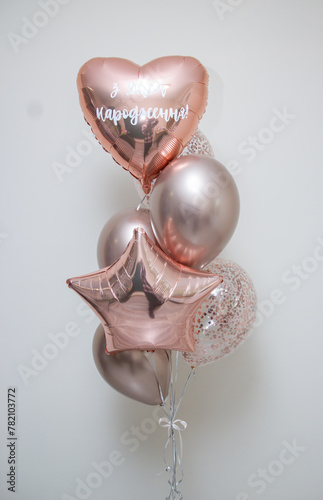 set of pink helium balloons on white background, inscription: "Happy Birthday"