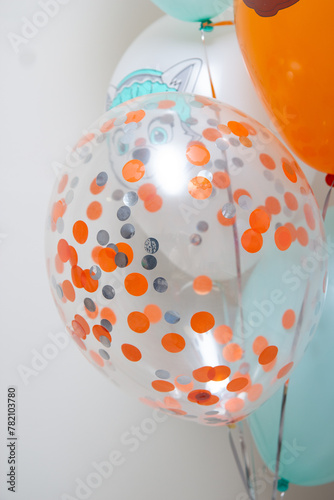 balloon with bright confetti for birthday