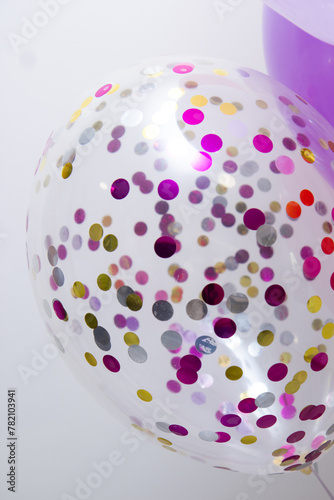 balloon with bright confetti on a white background