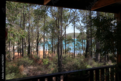 Logue Brook Dam (Lake Brockman). Turquoise colored water, seen through trees from cafe photo