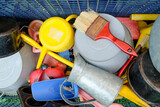 Colorful array of common household items and tools in a disorganized arrangement