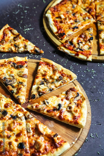 Sliced Pizza on Wooden Cutting Board