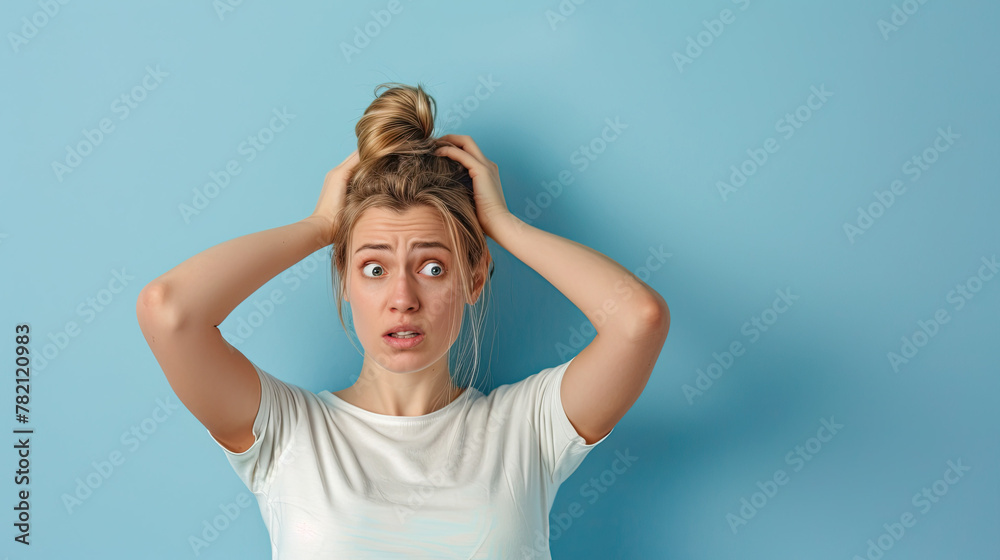 Portrait of a confused puzzled minded woman on pastel blue background Portrait of a confused puzzled minded woman on pastel blue background