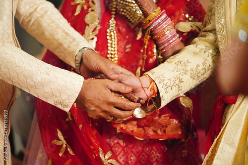 Mumbai, India 9th April 2024: Indian Wedding rituals, Customs and Traditions for bride or Dulhan. Pandit performing holy pooja. Shagun, Mehendi, and old customs. Couple holding hands during marriage