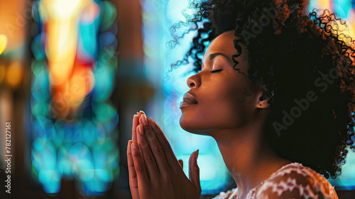 Prayer, christian and worship with black woman in church for god, holy spirit and spirituality photo