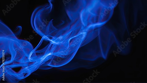 Beautiful blue smoke on a black background. © Romaboy