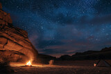 The desert night comes alive with a campfire's glow - stars overhead narrating the vastness of nature's grandeur