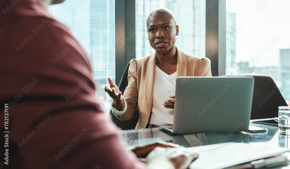 Business woman discussing work with a colleague in modern office Business woman discussing work with a colleague in modern office