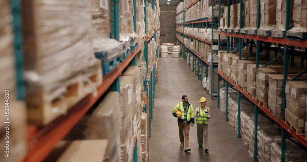Distribution, logistics and stock with warehouse team walking together to check supply chain storage. Delivery, product or shelves with man and woman in factory for collaboration on tablet in plant