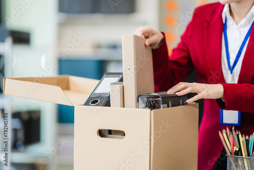 Photos In the office, shot captures the supervisor signing the resignation mail, careful and calm as she finalizes the agreement