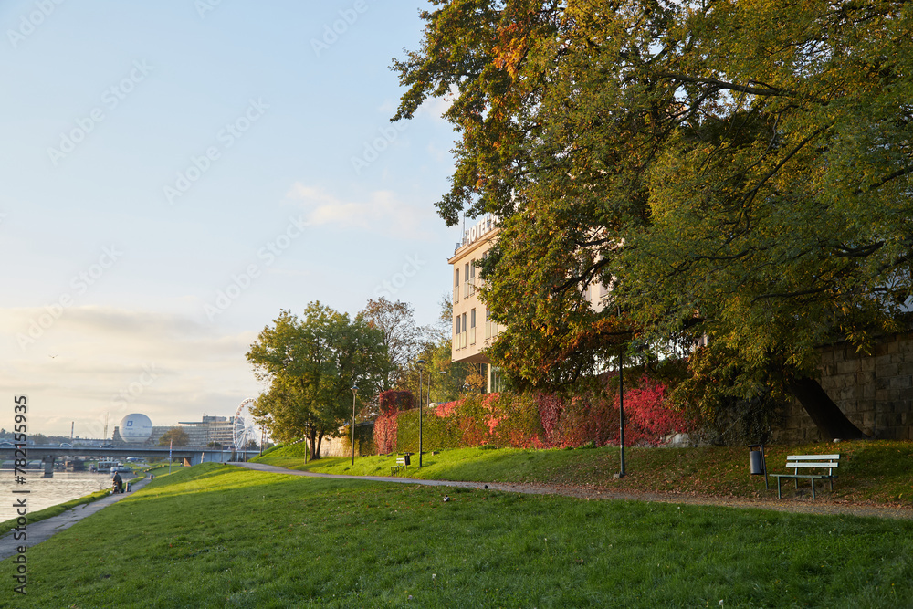 Krakow, Poland. 09.10.2022 Embankment road on the Vistula River at dawn in autumn In the warm rays of the sun. Krakow, Poland. 09.10.2022 Embankment road on the Vistula River at dawn in autumn In the warm rays of the sun.