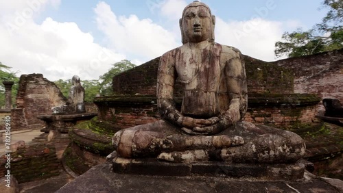 A sacred Buddha in the temple. The Ancient City of Polonnaruwa in Sri Lanka. Famous travel destination and landmark