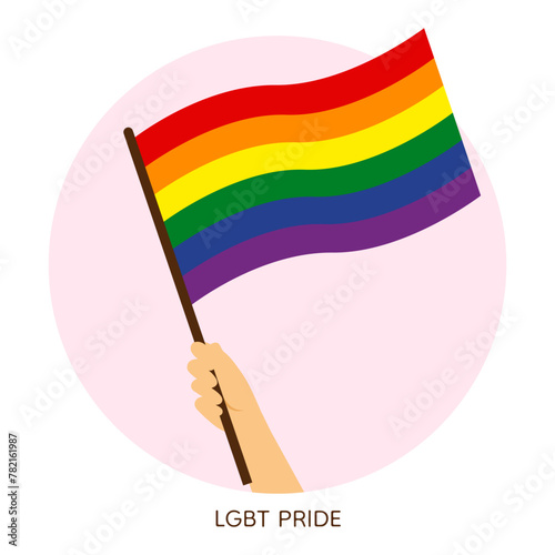 Hand holding rainbow pride flag