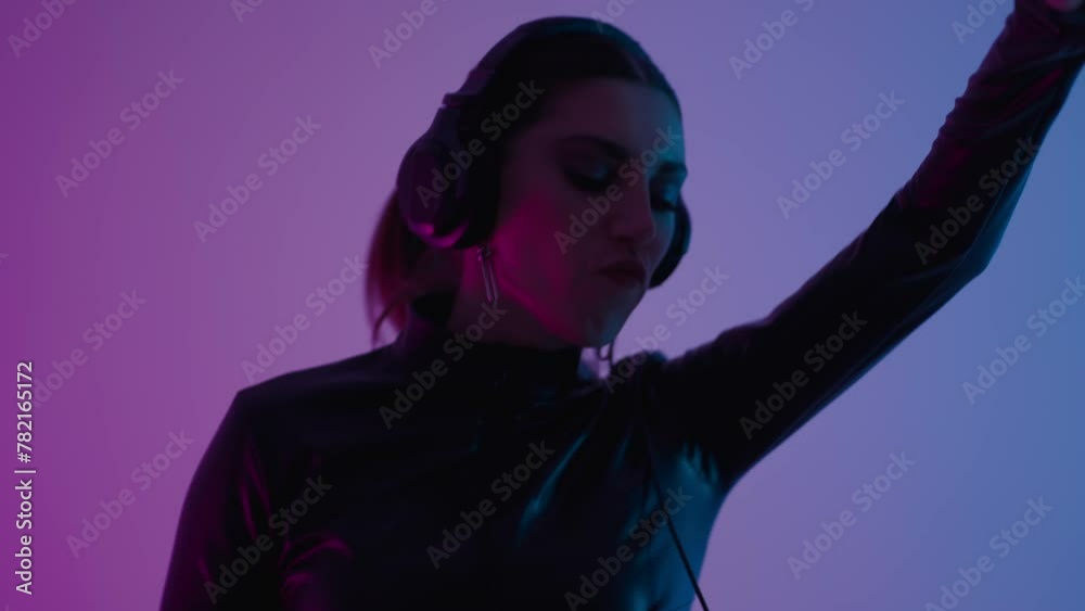 Excited Woman Dancing In DJ Studio, Portrait Of Female DJ Mixing Tracks By DJ Mixer In Nightclub Excited Woman Dancing In DJ Studio, Portrait Of Female DJ Mixing Tracks By DJ Mixer In Nightclub