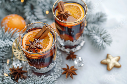 Festive homemade hot mulled wine with oranges cinnamon gingerbread on top. Top view with copyspace