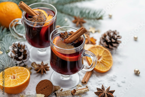 Festive homemade hot mulled wine with oranges cinnamon gingerbread on top. Top view with copyspace
