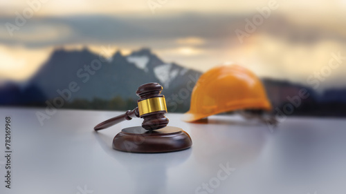 Focus on a hammer of justice on the foreground, in the background a hanging white worksite helmet. Construction law, building law, urban planning law. Generative AI used. 