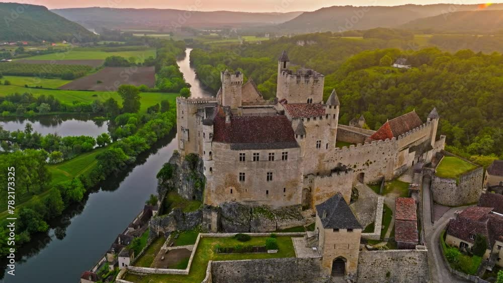 Aerial view of French castle, medieval fortress in France. Panoramic view of old architecture Château by the river in the middle of nature in France. Aerial view of French castle, medieval fortress in France. Panoramic view of old architecture Château by the river in the middle of nature in France.