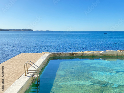 Public swimming pool near the ocean. Tidal pool. Rock Pool. Landscape, shore and view of the coast.