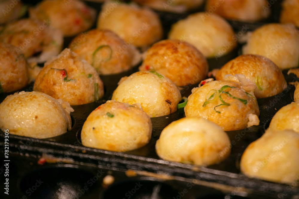 Authentic Takoyaki balls from Osaka. Takoyaki is a Japanese food made from wheat flour and octopus. Authentic Takoyaki balls from Osaka. Takoyaki is a Japanese food made from wheat flour and octopus.