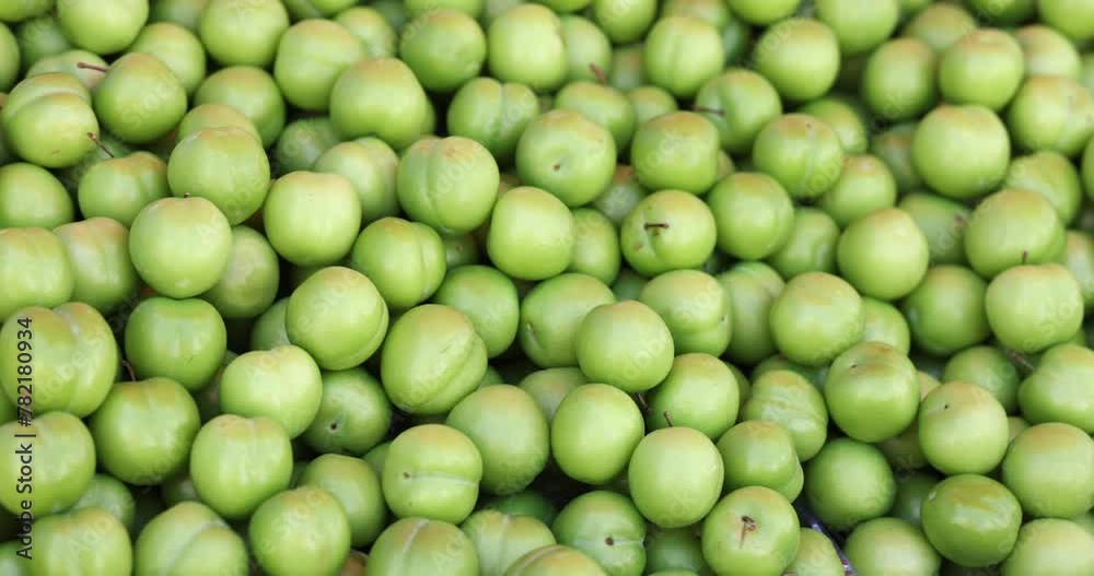 Fresh ripe juicy green plum fruits in market. Fresh tropical exotic fruit apples Fresh ripe juicy green plum fruits in market. Fresh tropical exotic fruit apples