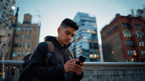 a handsome young Hispanic man skillfully navigating his smartphone, utilizing the latest 5G technology for seamless digital communication and social media engagement © INT888