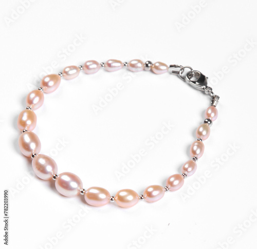 Baroque pearl bracelet isolated on white background. Top view