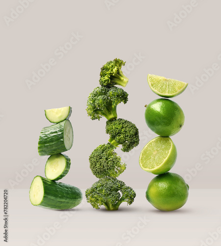 Creative layout made of broccoli, cucumber and lime on the beige background. Food concept. Macro concept. (ID: 782204720)