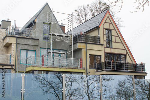 scaffolding and external facade finishing of duplexes photo