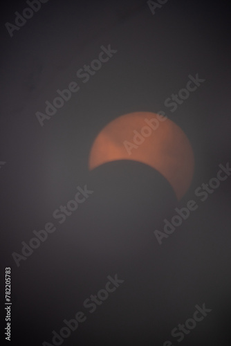 This is the solar eclipse seen from Pennsylvania on April 8th, 2024. This is only partial and not full. The beautiful fireball is being covered by the moon. The oranges and yellows are so bright.