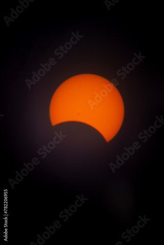 This is the solar eclipse seen from Pennsylvania on April 8th, 2024. This is only partial and not full. The beautiful fireball is being covered by the moon. The oranges and yellows are so bright. © Larry