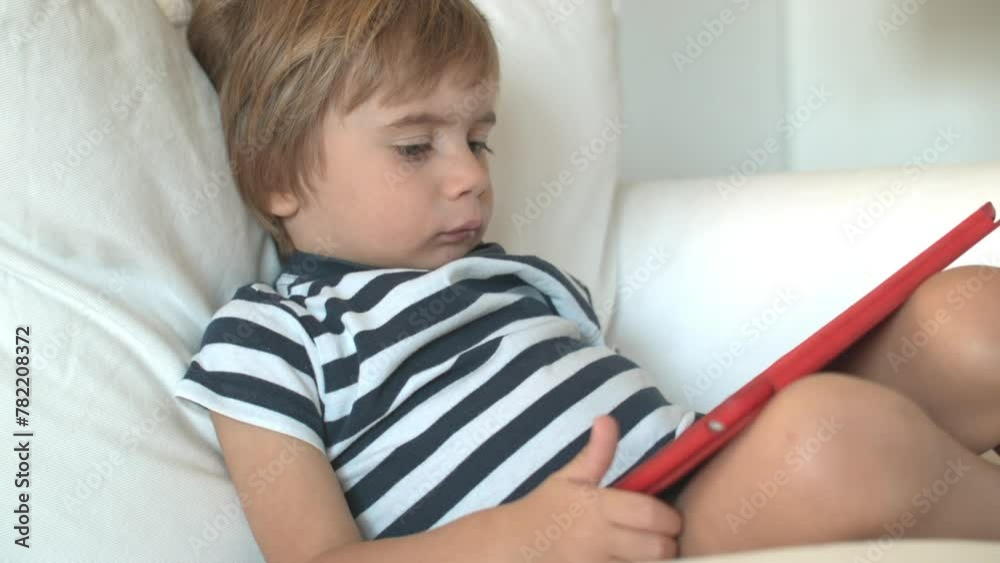 Young boy using a digital tablet Young boy using a digital tablet