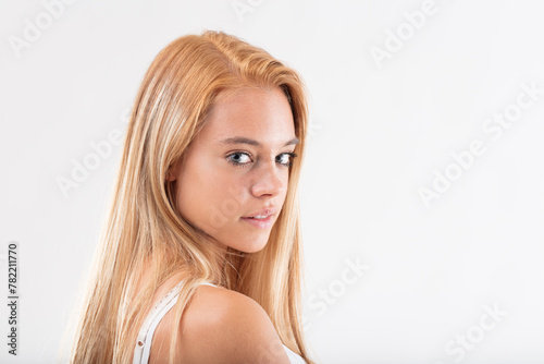 Side-view portrait, reflective young blonde woman